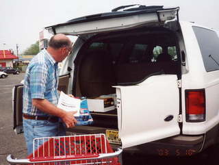 John Schubel loading his Ford Excursion