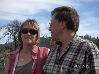 Linda and Loren Lee amid burnt trees