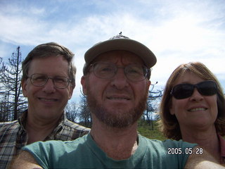 Loren, Adam, and Linda amid burnt trees