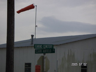 Eakins Cemetary and Clark Airfield Road sign with windsock