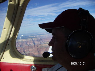 Tim Higel in silhouette over the Grand Canyon