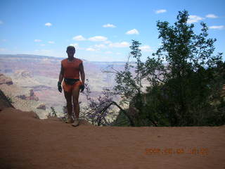 Plateau Point -- Mighty Colorado River -- Adam on rock ledge