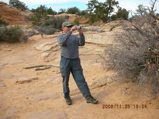 Canyonlands -- Bob taking a picture at Mesa Arch