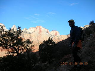 482 61u. Zion National Park - Watchman hike - Adam in silhouette