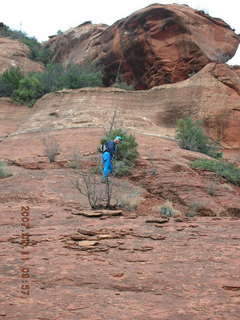 505 62b. Sedona -- Secret Canyon hike -- Adam climbing slickrock