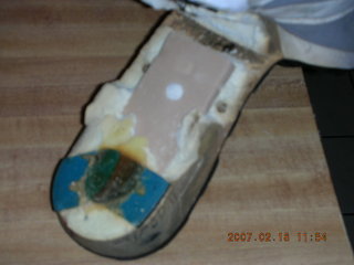 a very old running shoe falling apart