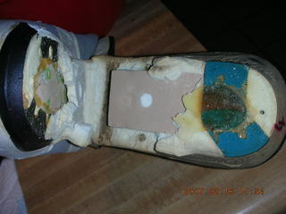 a very old running shoe falling apart