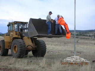 Young -- Chapman Ranch Airport - loader raising Arv and Bob for wind sock replacement