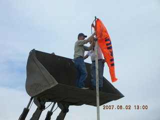 Young -- Chapman Ranch Airport - loader raising Arv and Bob for wind sock replacement