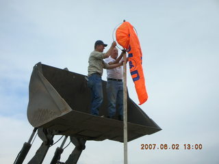 Young -- Chapman Ranch Airport - loader raising Arv and Bob for wind sock replacement