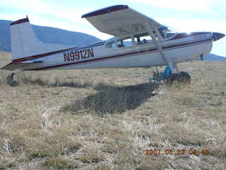 Young -- Chapman Ranch Airport - loader raising Arv and Bob for wind sock replacement