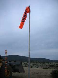 Young -- Chapman Ranch Airport - loader raising Arv and Bob for wind sock replacement