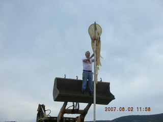 Young -- Chapman Ranch Airport - Arv on loader working on wind sock