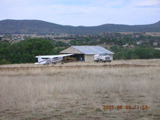 Young -- Chapman Ranch Airport - Arv on loader working on wind sock