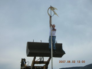 Young -- Chapman Ranch Airport - Arv on loader working on wind sock