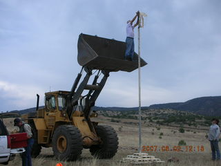 Young -- Chapman Ranch Airport - Arv on loader working on wind sock