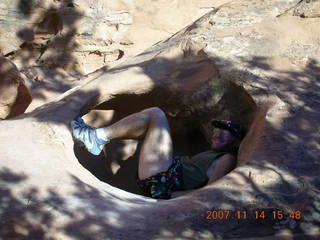 683 6be. Arches National Park - Devils Garden hike - Adam in hole in rock