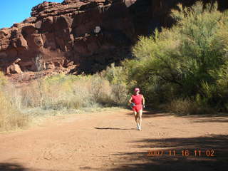 7 6bg. Canyonlands National Park - Lathrop Trail hike - Adam (tripod) running