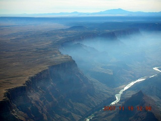 airplane flying over canyon