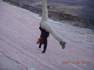 399 6cw. Zion National Park - slickrock - gymnastic girl doing cartwheel