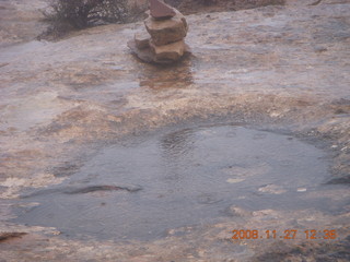 Canyonlands National Park - Lathrop trail hike - raindrops on pothole puddle