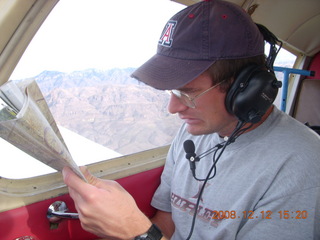 Matt reading a chart flying in N4372J