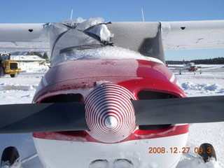 icy, snowy airplane with spiral spinner at Flagstaff Airport (FLG)