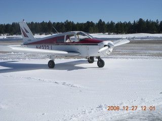 snowy, ice twin-engine airplane at Flagstaff Airport (FLG)