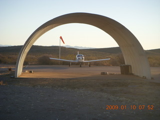 3 6ra. Tombstone Airport (P29) - N4372J seen through parking hangar