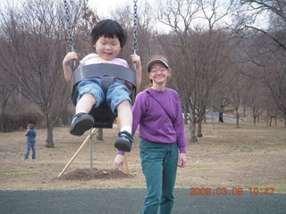 Cecelia and Betsy at the swings