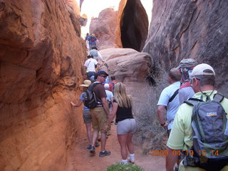 Arches National Park - Fiery Furnace hike - Adam in a hole in the rock