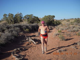 Canyonlands - Lathrop trail hike - Adam at trailhead sign