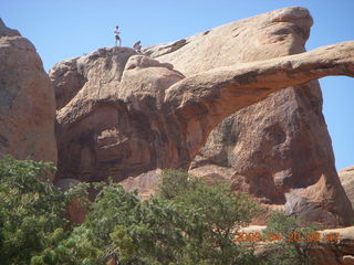 72 6ul. Arches National Park - Devil's Garden hike - two fellows atop Double-O Arch
