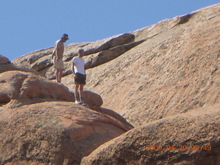 75 6ul. Arches National Park - Devil's Garden hike - two fellows atop Double-O Arch