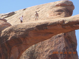 76 6ul. Arches National Park - Devil's Garden hike - two fellows atop Double-O Arch