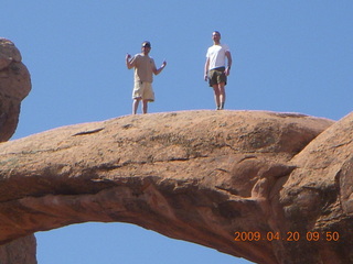 78 6ul. Arches National Park - Devil's Garden hike - two fellows atop Double-O Arch