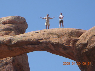 79 6ul. Arches National Park - Devil's Garden hike - two fellows atop Double-O Arch
