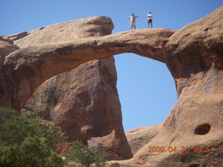80 6ul. Arches National Park - Devil's Garden hike - two fellows atop Double-O Arch
