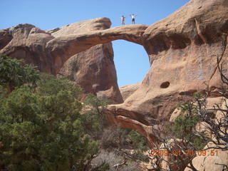 81 6ul. Arches National Park - Devil's Garden hike - two fellows atop Double-O Arch