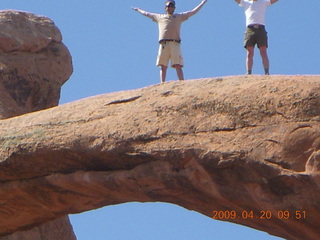82 6ul. Arches National Park - Devil's Garden hike - two fellows atop Double-O Arch