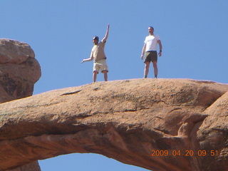 83 6ul. Arches National Park - Devil's Garden hike - two fellows atop Double-O Arch