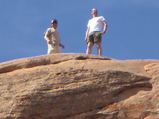 89 6ul. Arches National Park - Devil's Garden hike - two fellows atop Double-O Arch