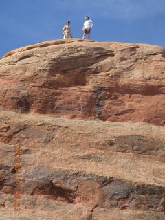 90 6ul. Arches National Park - Devil's Garden hike - two fellows atop Double-O Arch