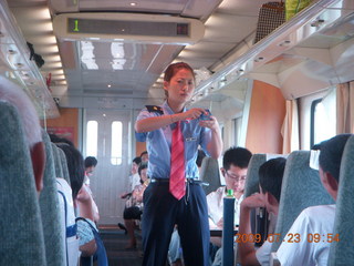 China eclipse - Hangzhou to Shanghai train ride - lady selling toys