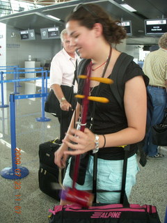 China eclipse - Shanghai airport - lady with interesting musical instrument