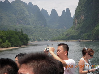 China eclipse - Li River  boat tour - Adam backlit