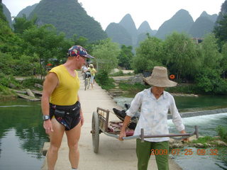 China eclipse - Yangshuo bicycle ride - walk to farm village - Adam and farm worker
