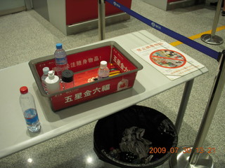 China eclipse - Beijing airport no-fluids bin