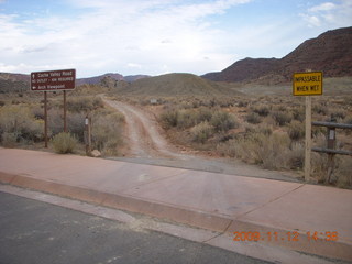 89 71c. Arches National Park - Delicate Arch - dirt road with signs