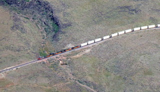 Sean's picture - Bagdad mine tour - Sean and Kristina and big chained tire